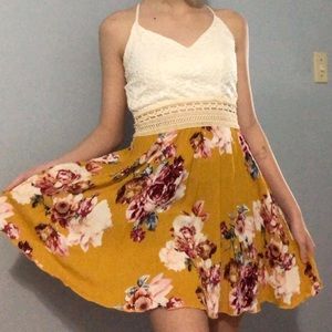 A yellow / floral, slightly above the knee dress